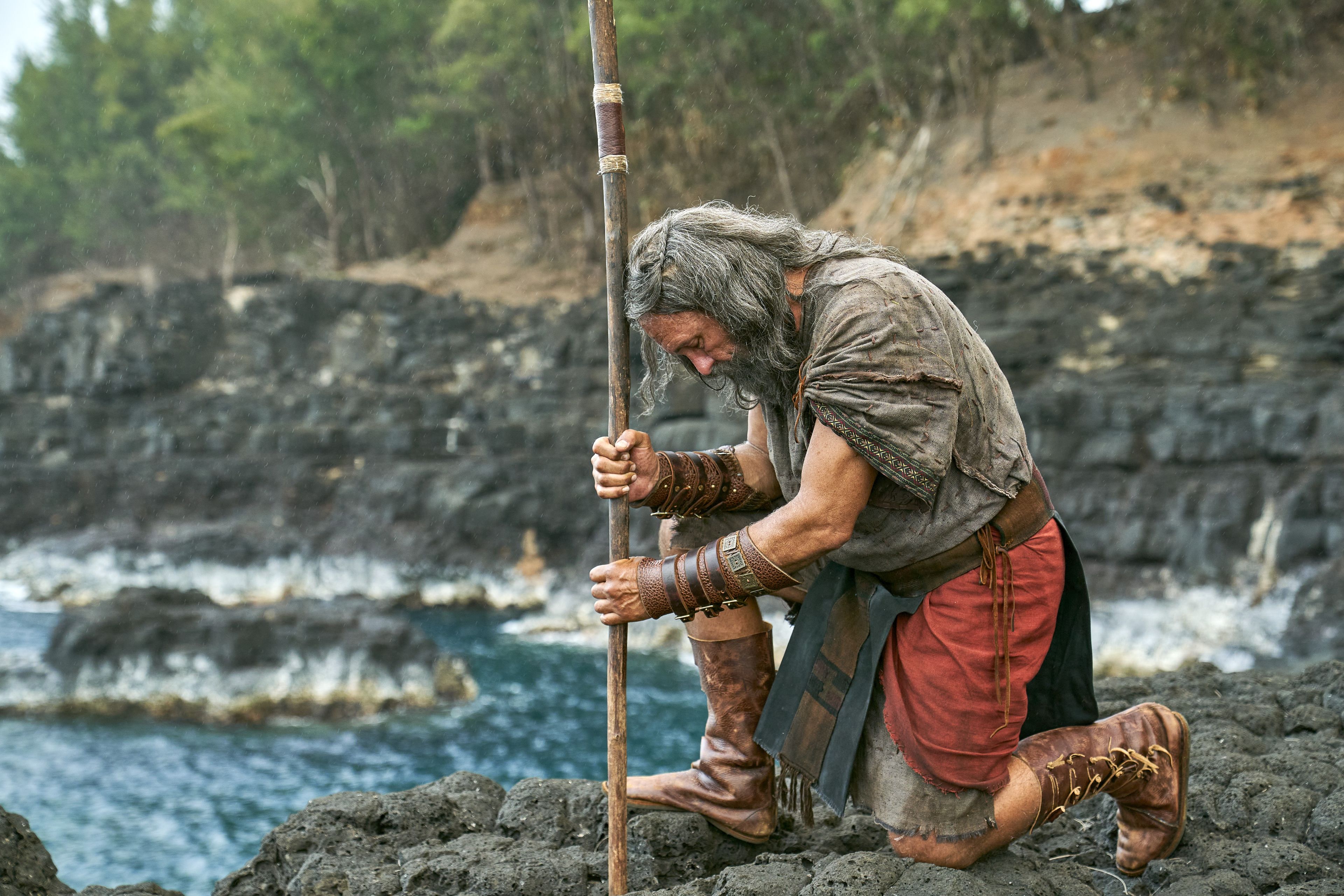Moroni, son of Mormon, prays on a rocky shore overlooking the ocean.