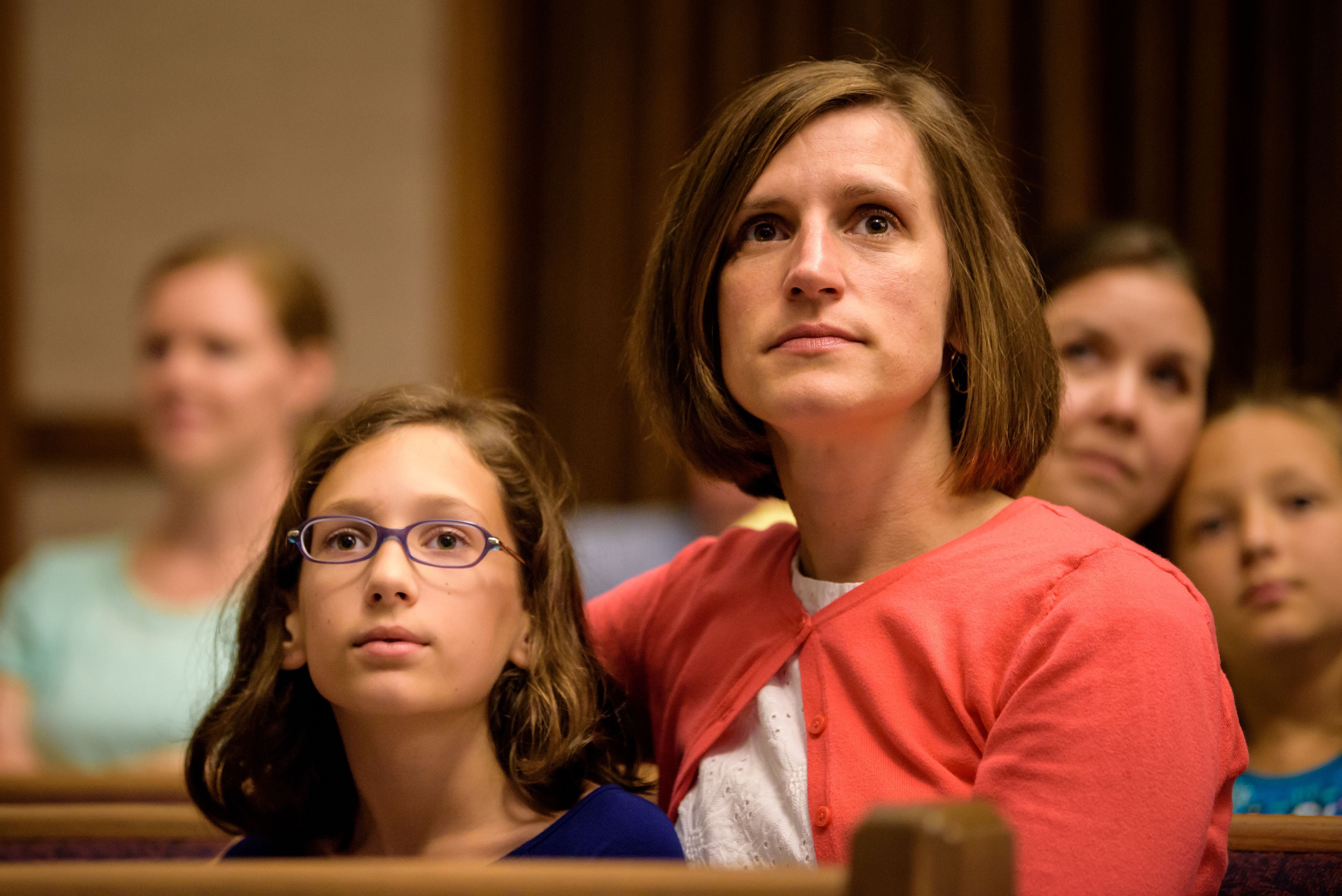 A mother and daughter watch the general women’s session of general conference at the Roswell Georgia Stake center.
