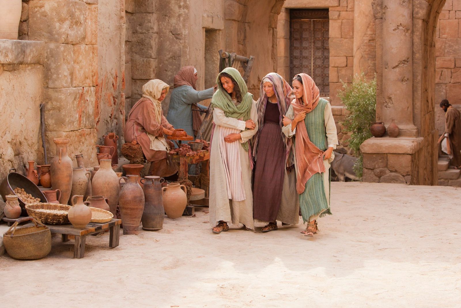 Mary walks through the streets with her cousin, Elisabeth.