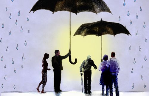 people standing under umbrellas