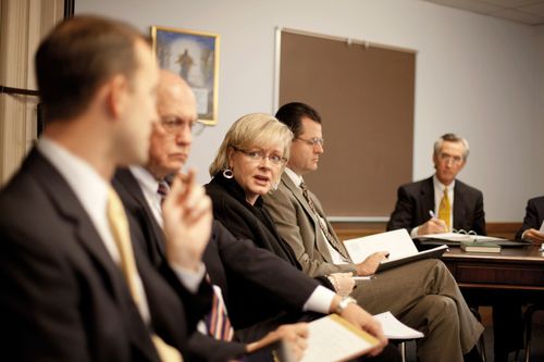 Bishopric and ward leaders meeting together in a ward council meeting.