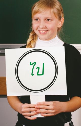 girl standing in front of chalkboard