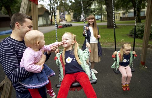 family on the swings