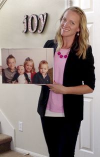 woman holding photo of her children