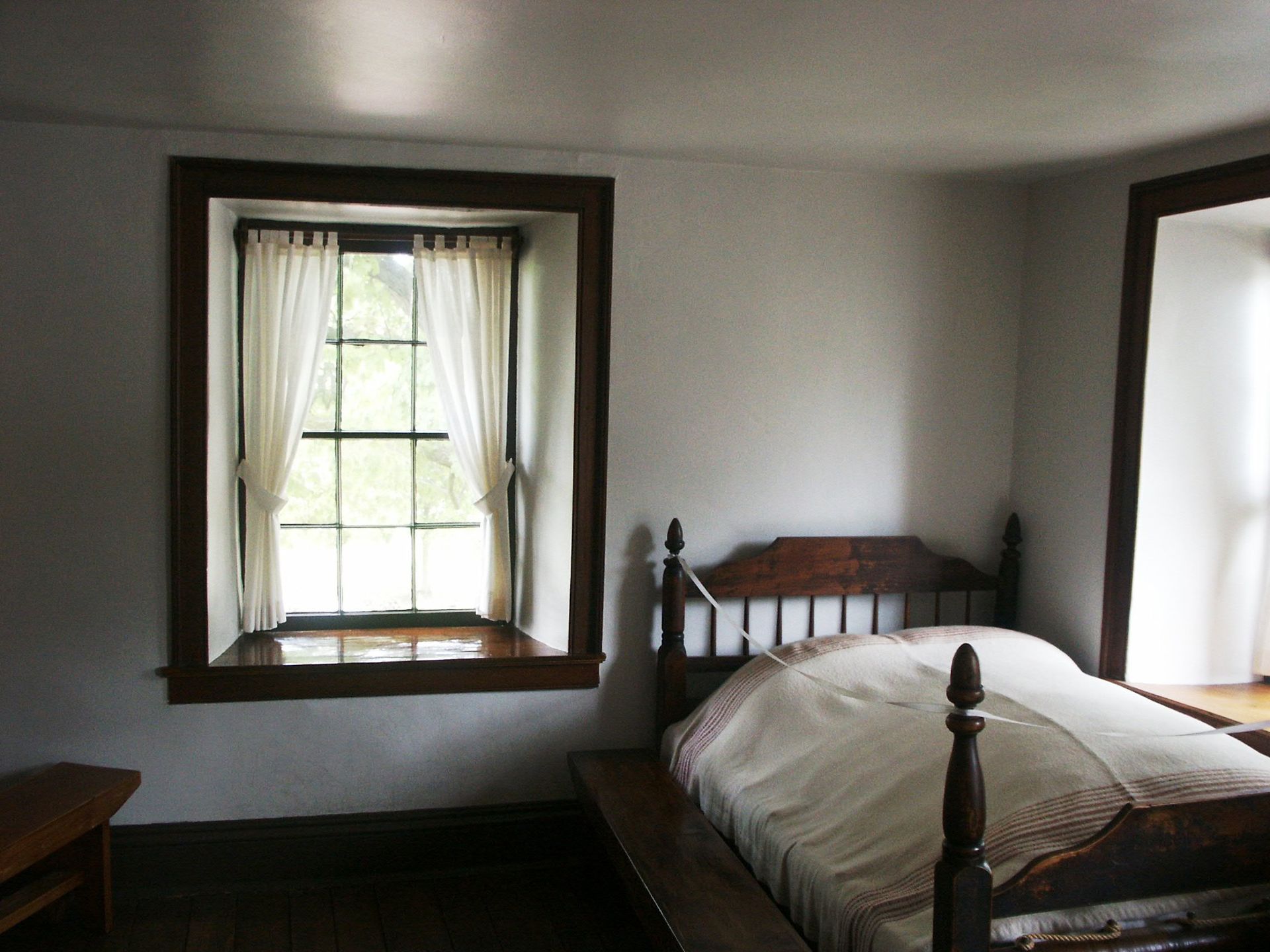 An image of the bed in the Carthage Jail bedroom where Joseph and Hyrum Smith were martyred.