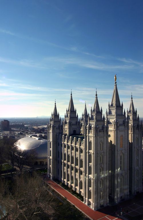 An aerial view of the entire Salt Lake Temple, with the Tabernacle seen behind the temple.