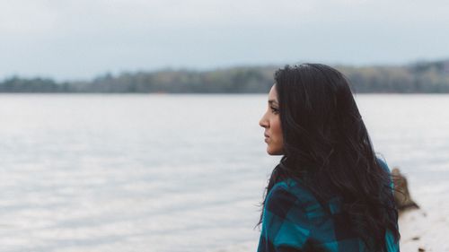 woman looking out over water