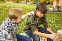 youth comforting friend