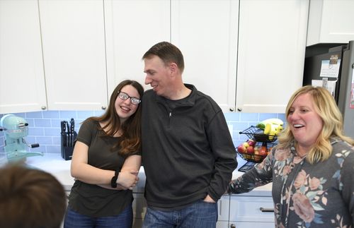 young woman with parents