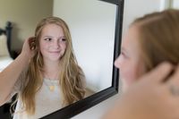 teenager looking in a mirror