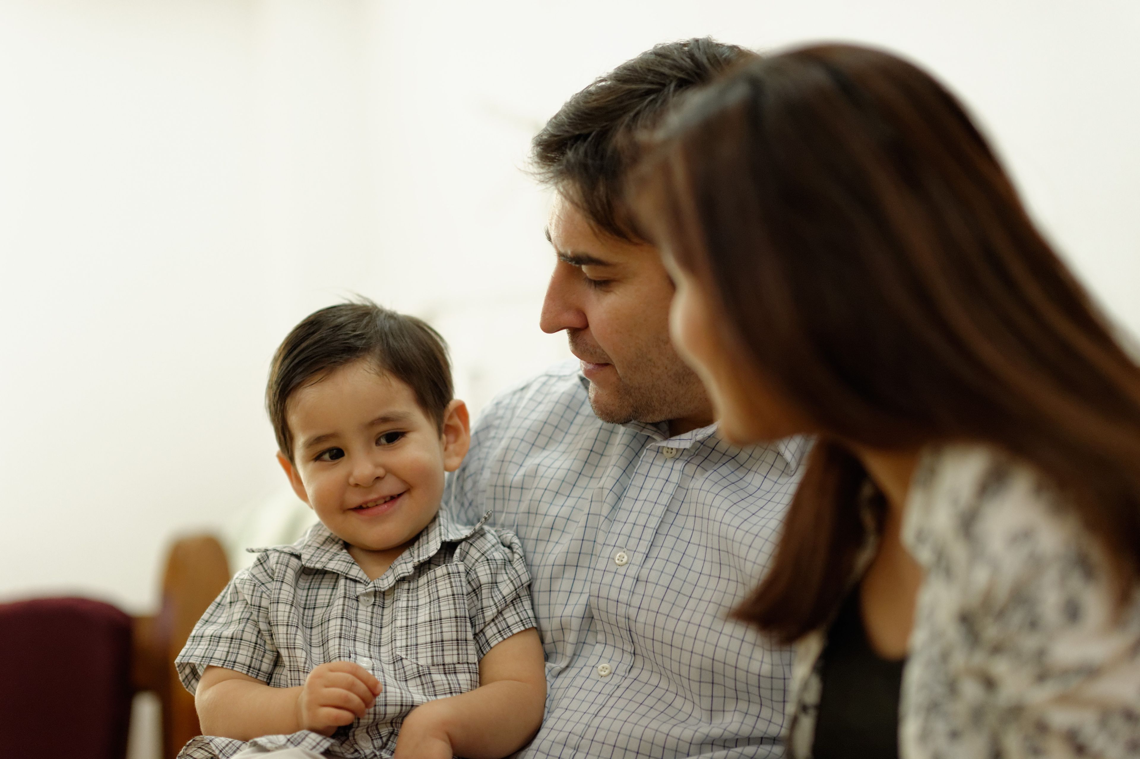 Parents spend time with their toddler son.