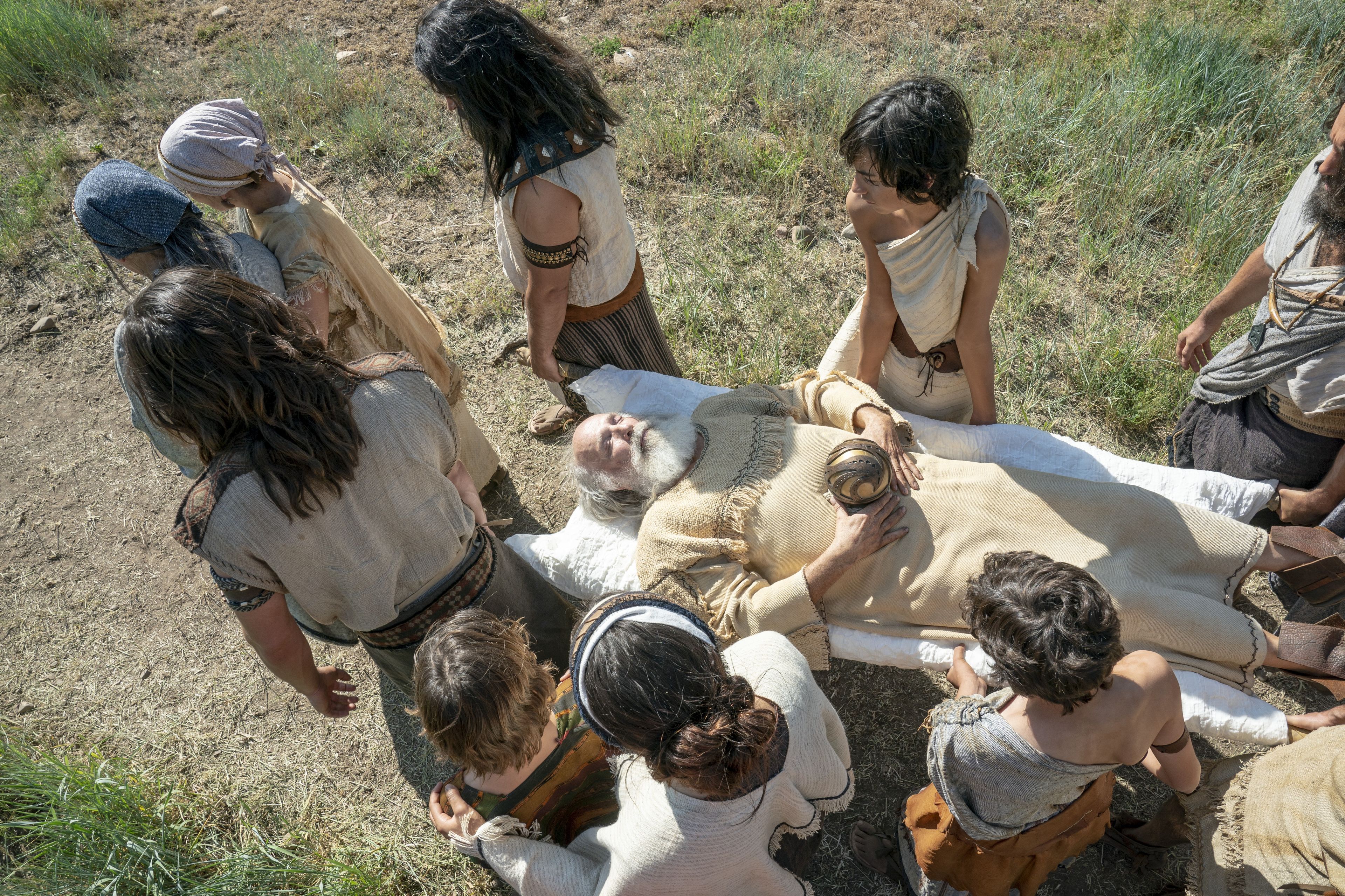 Lehi's family carries his body to his burial.