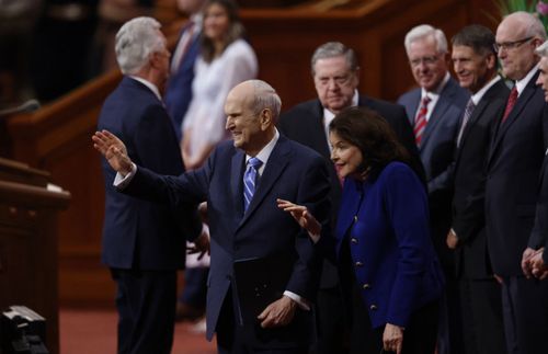 President and Sister Nelson waving to young adults