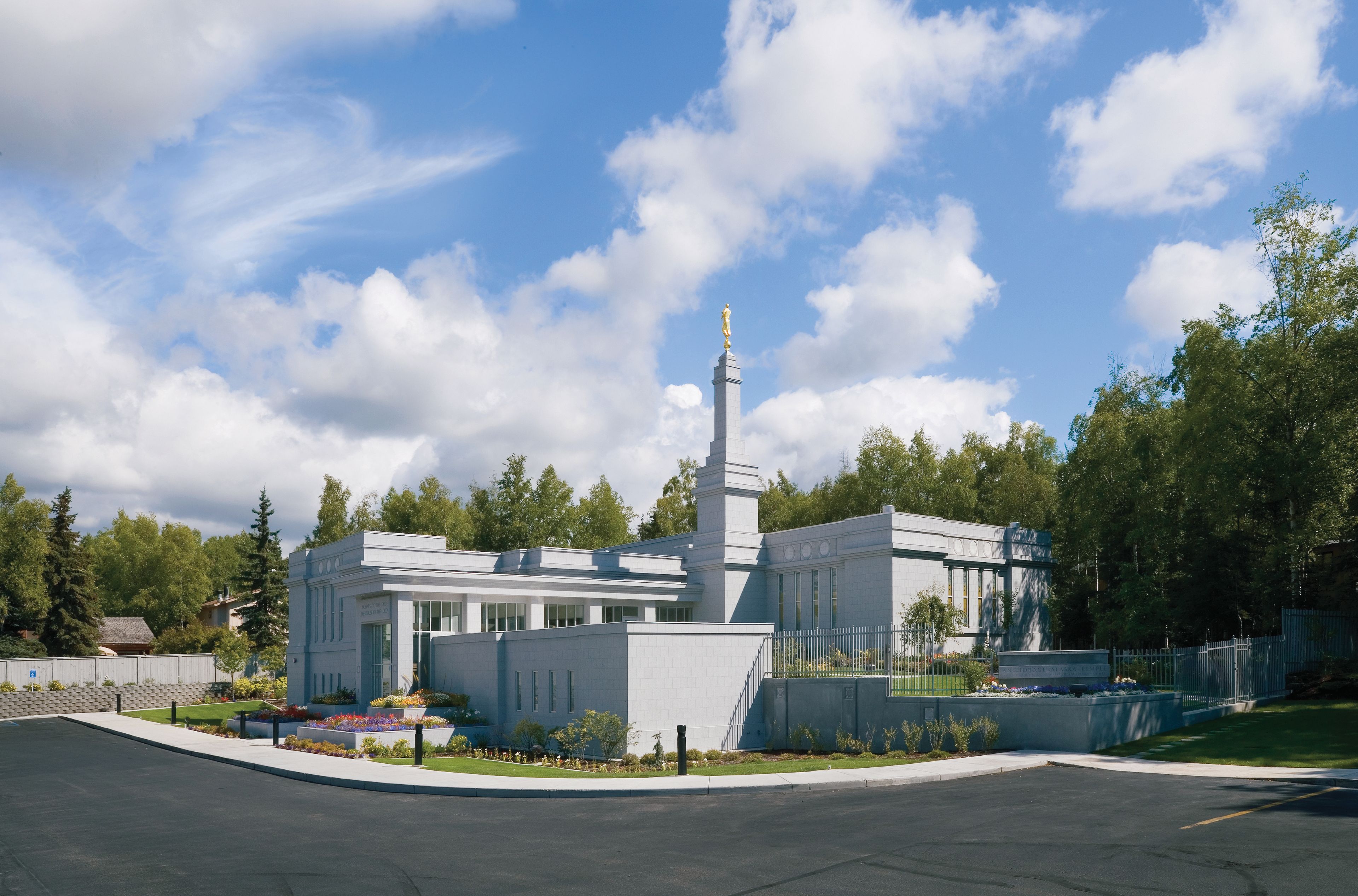 A view of the Anchorage Alaska Temple and grounds during the day.
