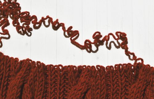 crocheted fabric being unraveled