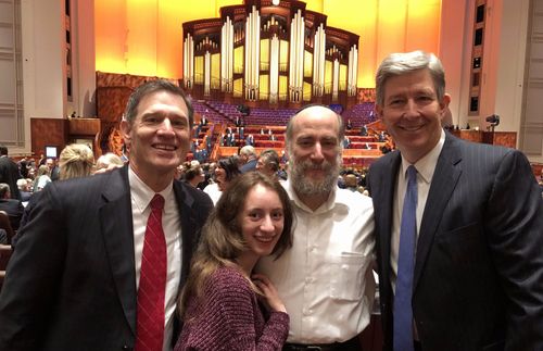 Rabbi Joe attending general conference with his friend, his daughter, and a member of the Seventy