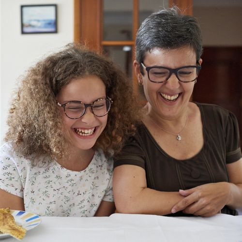 mother and daughter laughing