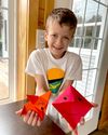 Boy holding origami