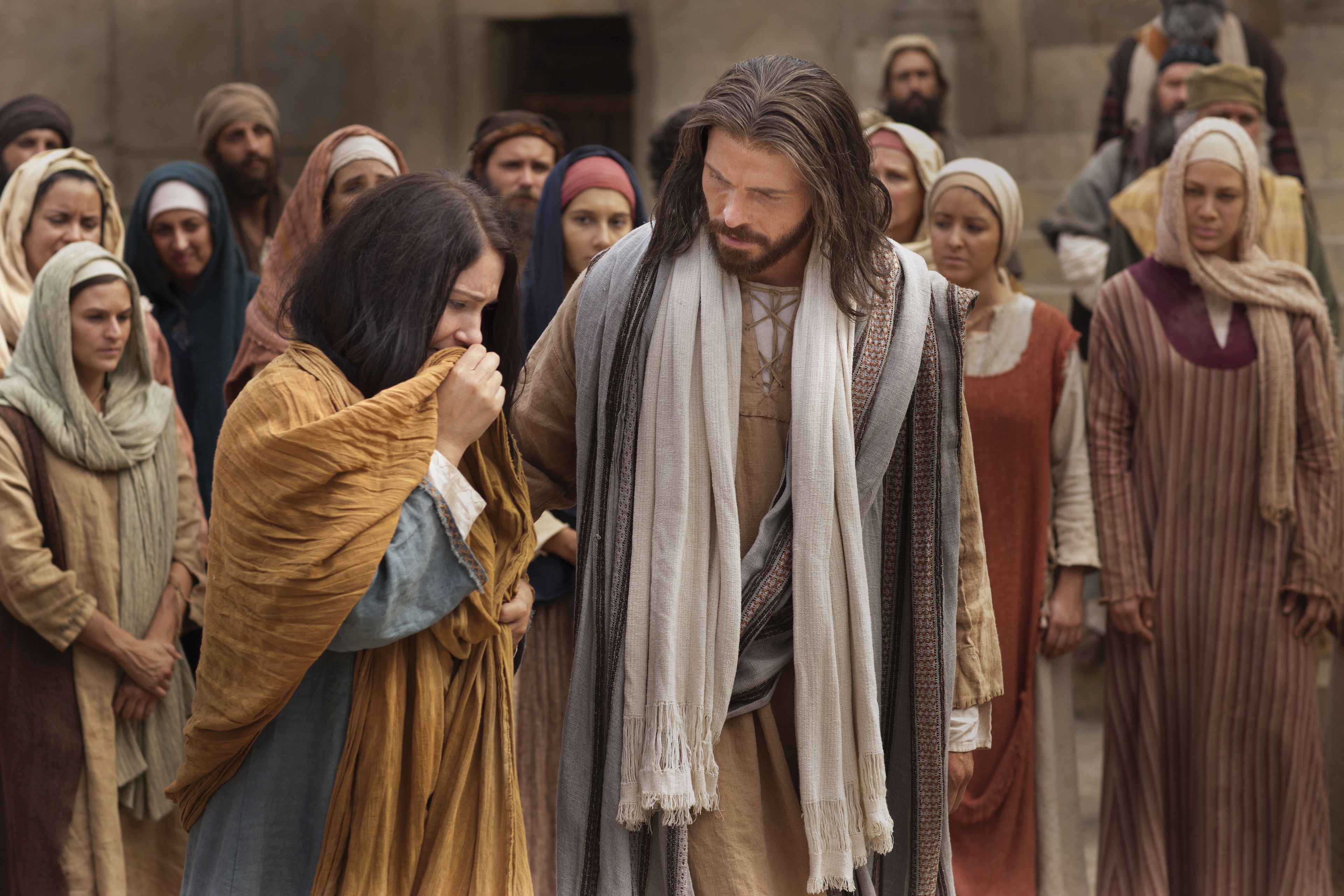 Jesus walking and talking with the woman taken in adultery.