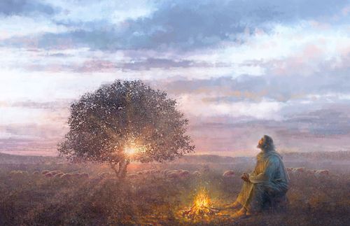 Jesus sitting alone by a fire