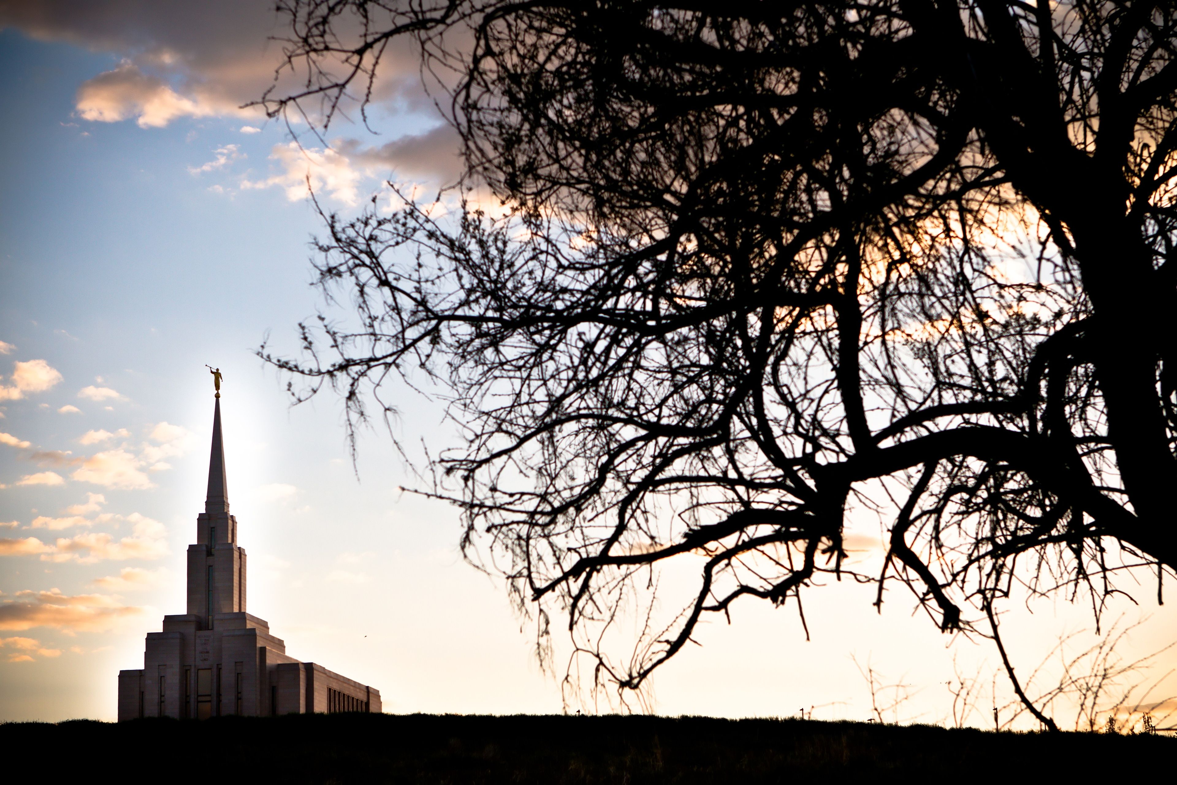 The Oquirrh Mountain Utah Temple at sunset, including scenery.