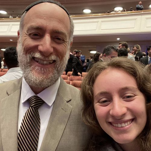 Rabbi Joe and his daughter taking a picture together at general conference