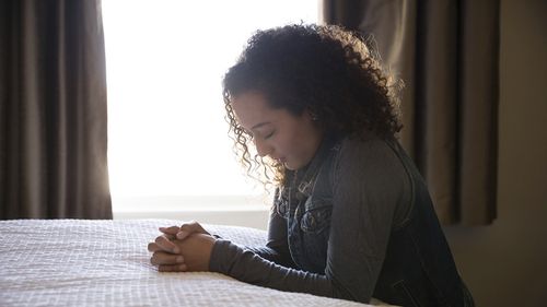 young woman praying