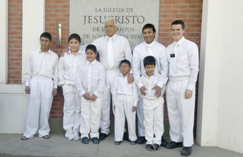 "Four boys from the same ward in Argentina were baptized on the same day. Their bishop (center) stands with them."  A missionary and other men are also in the group.