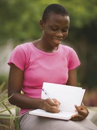 woman writing in journal