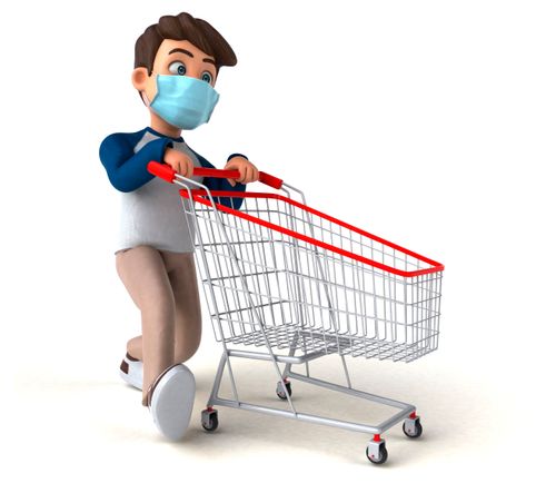 A boy is pushing a shopping cart. He is wearing a mask.