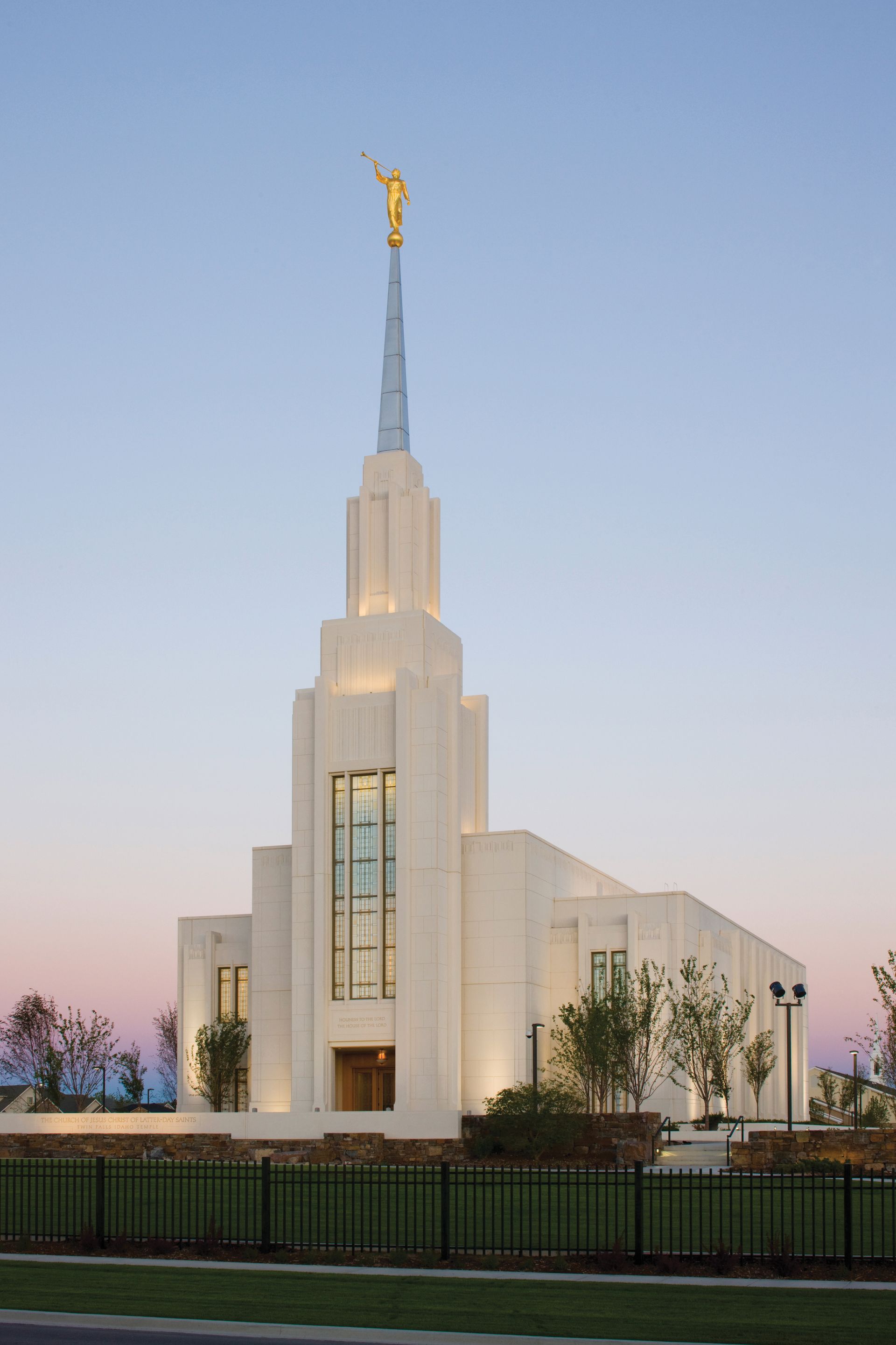 The Twin Falls Idaho Temple in the evening, with the entrance and scenery.