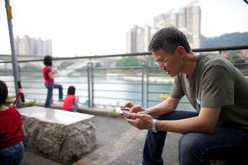 man looking at phone