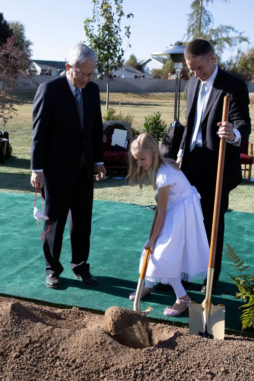 a young girl diggint at groundbreaking