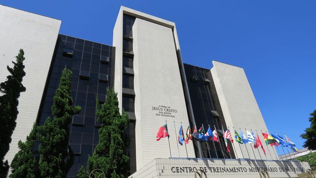 Closeup of the front of the Missionary Training Center in Brazil.  Shows a display of flags from various countries.