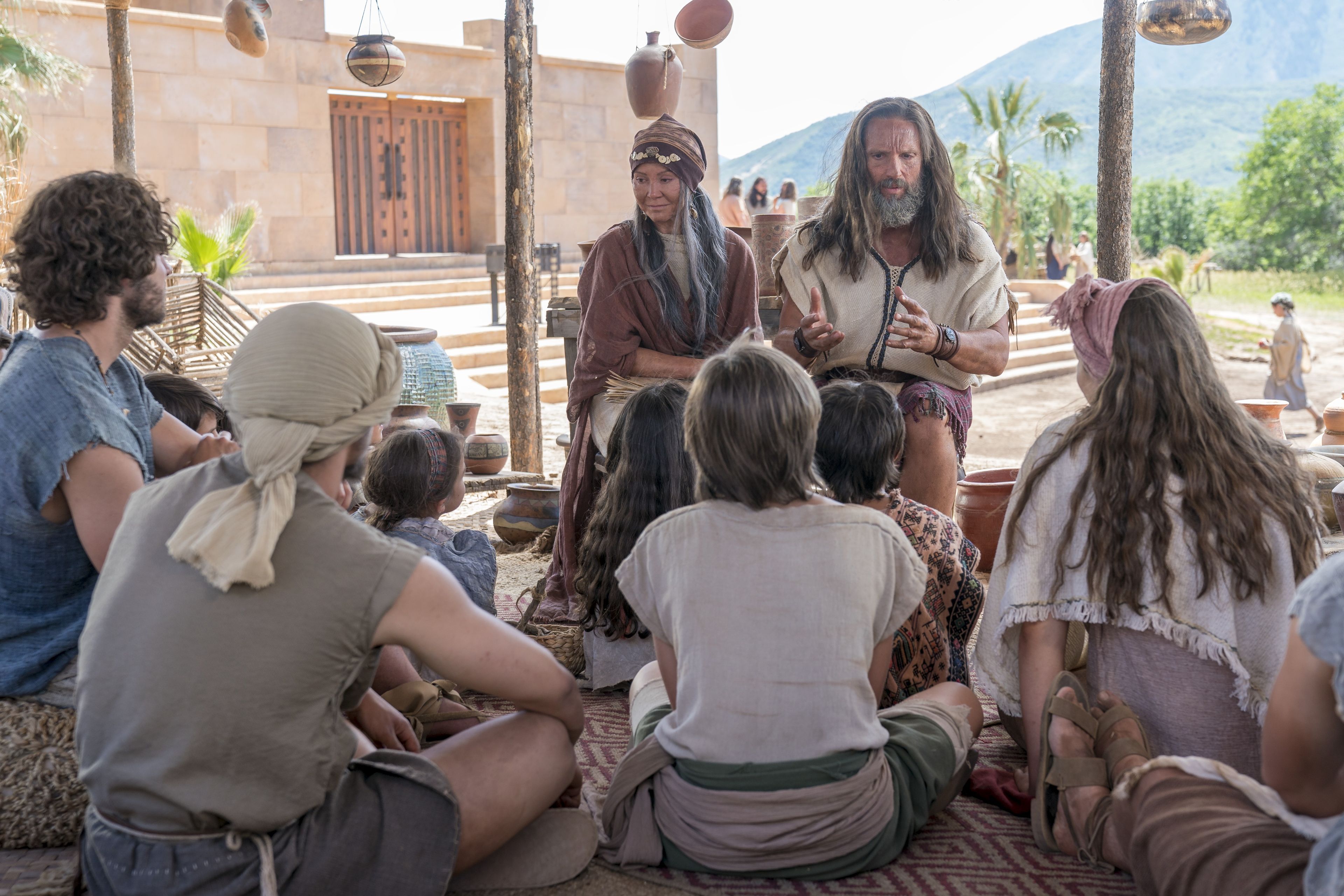 Nephites gather around as Nephi teaches them about baptism and the doctrine of Christ.