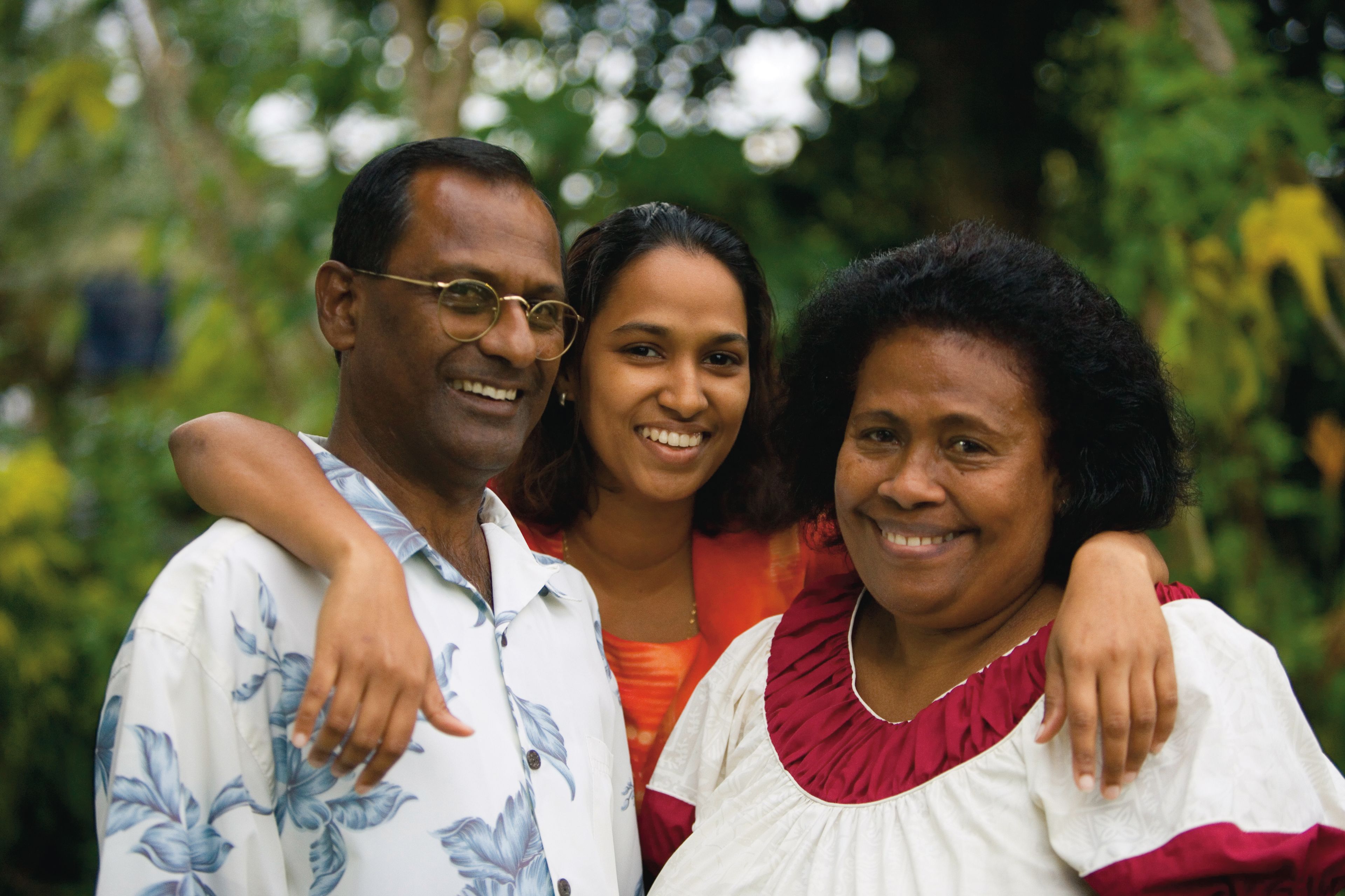 A portrait of a couple with their daughter in Fiji.