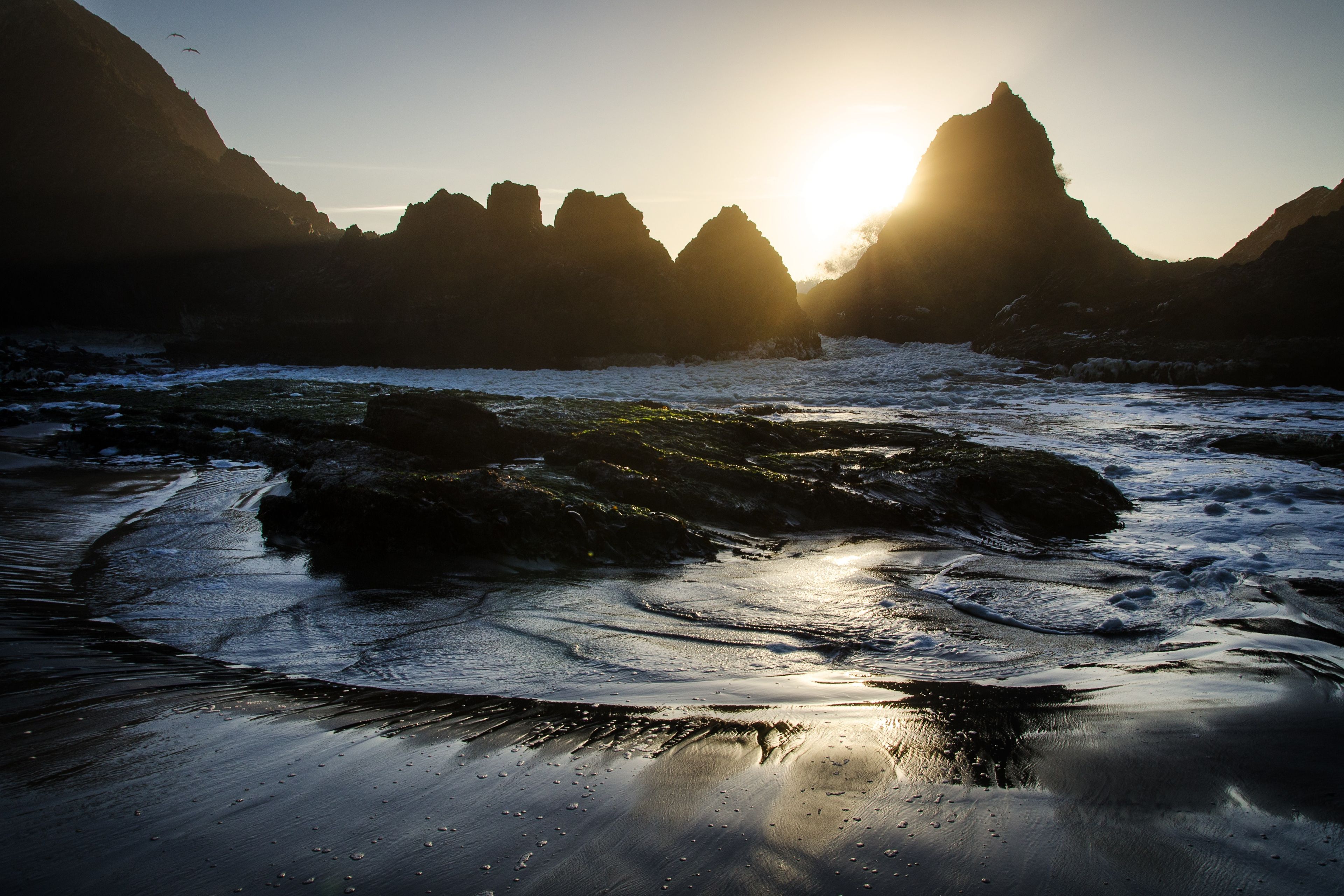 The sun sets on an Oregon beach.