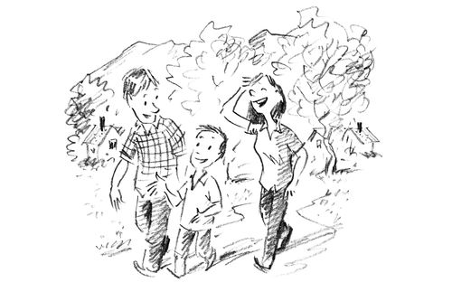 boy and parents enjoying a walk together