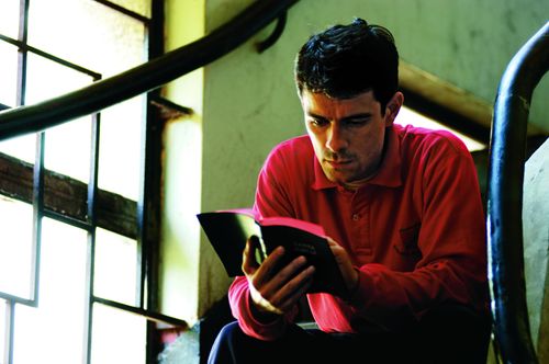 PEF Man from Santiago, Chile reading scriptures on the stairs