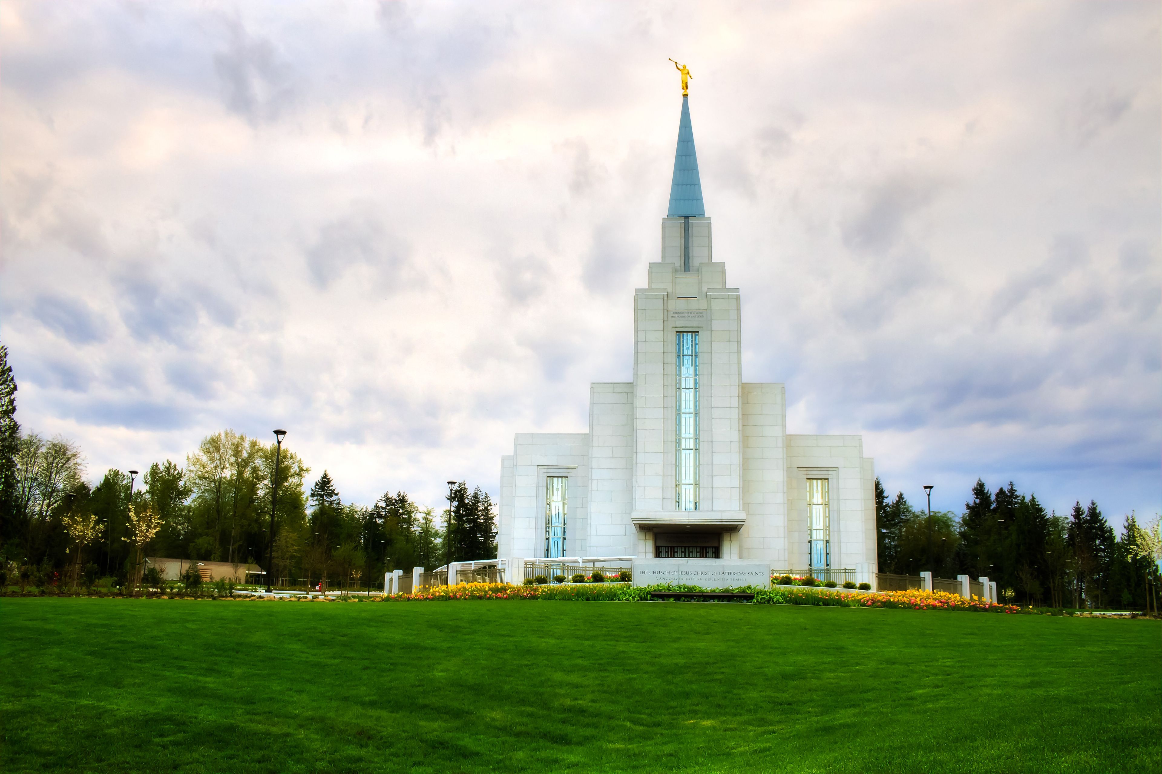 The Vancouver British Columbia Temple, including the entrance, name sign, and scenery.