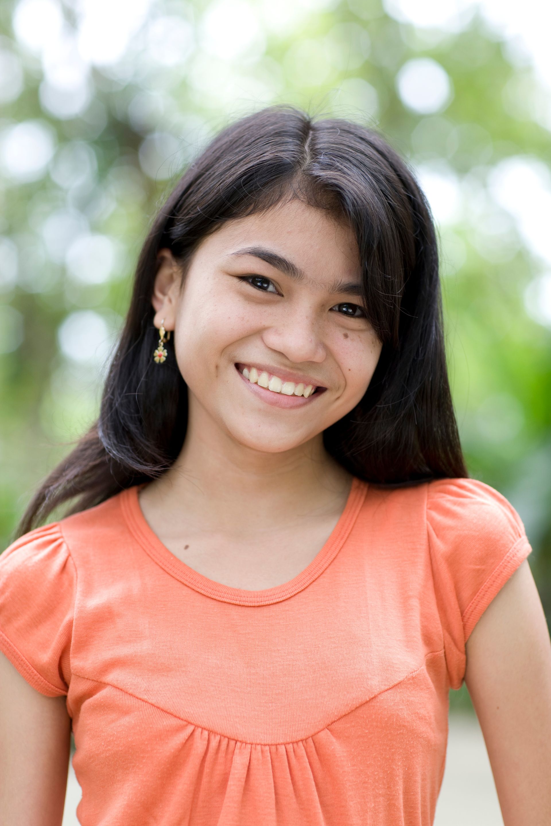 A portrait of a young woman from the Philippines.