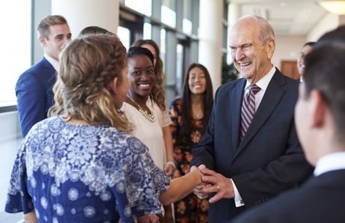 Russell M. Nelson with young adults