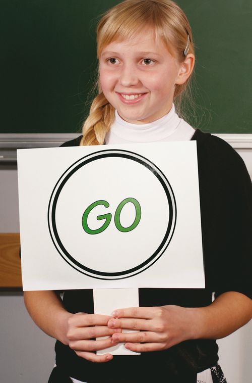 girl standing in front of chalkboard