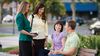 sisters talking with couple