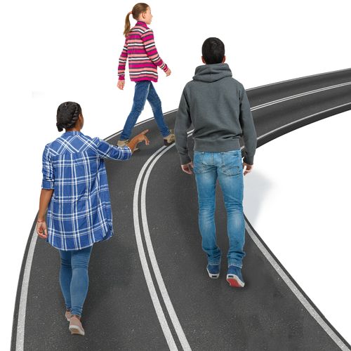 young people walking on a road