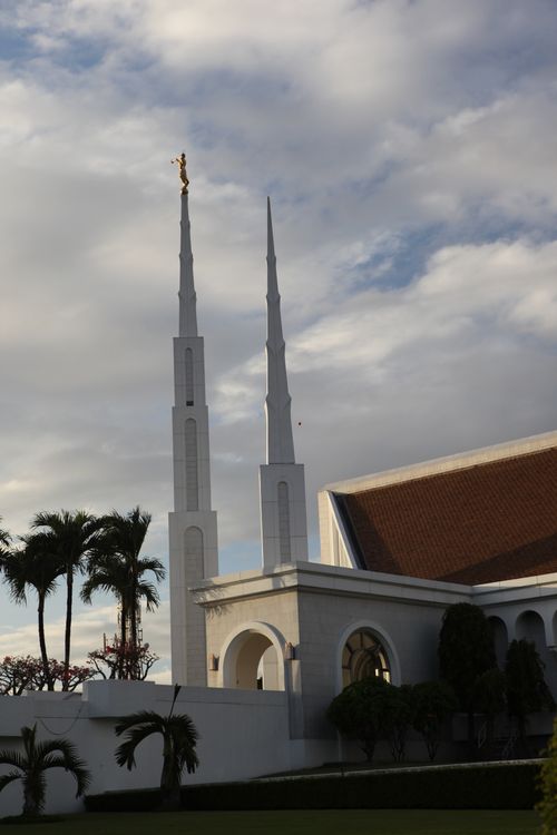 A side view of the Manila Philippines Temple spires and entrance.