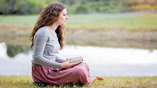 young woman reading scriptures