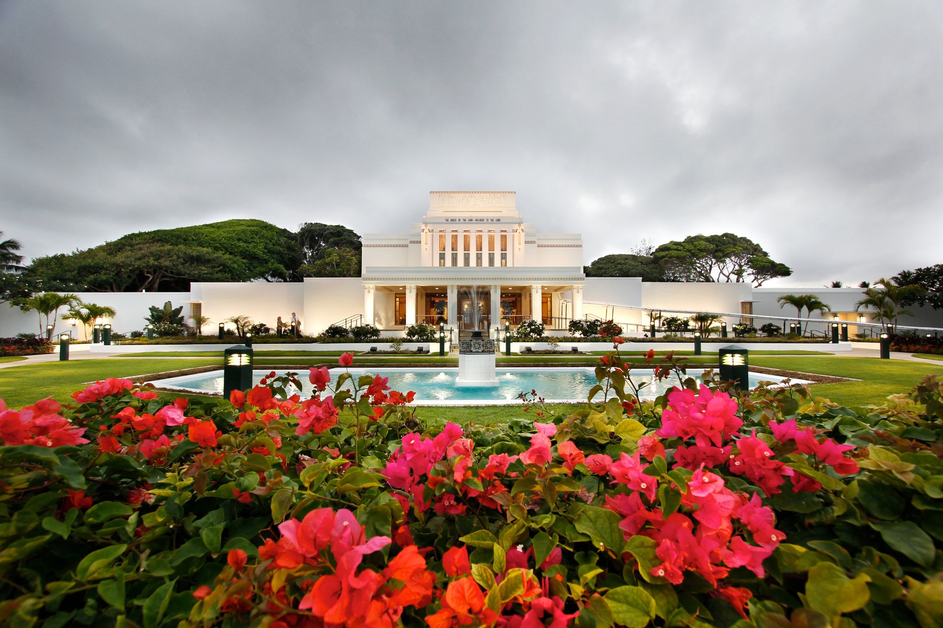 The Laie Hawaii Temple entrance, including a pond and scenery.