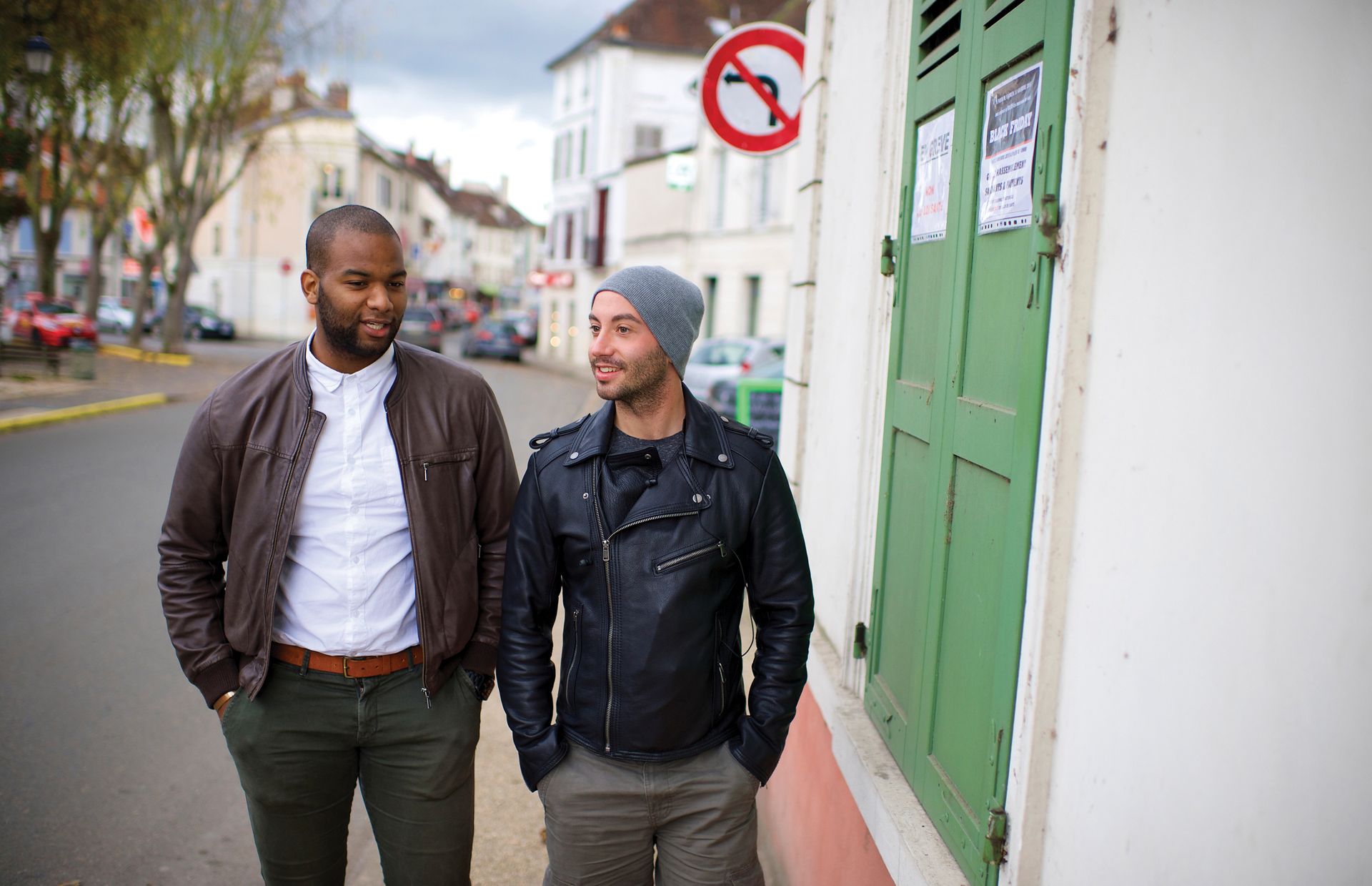 Cayo Sopi (left) and Anthony Linat (right) walk through their neighborhood in the suburbs of Paris, France. They have been friends since childhood.