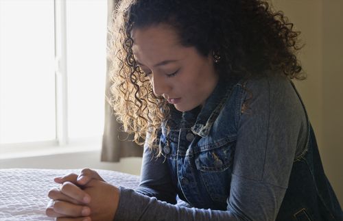 young adult praying